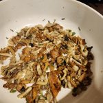 variety of gourmet mushrooms sauteing in pan